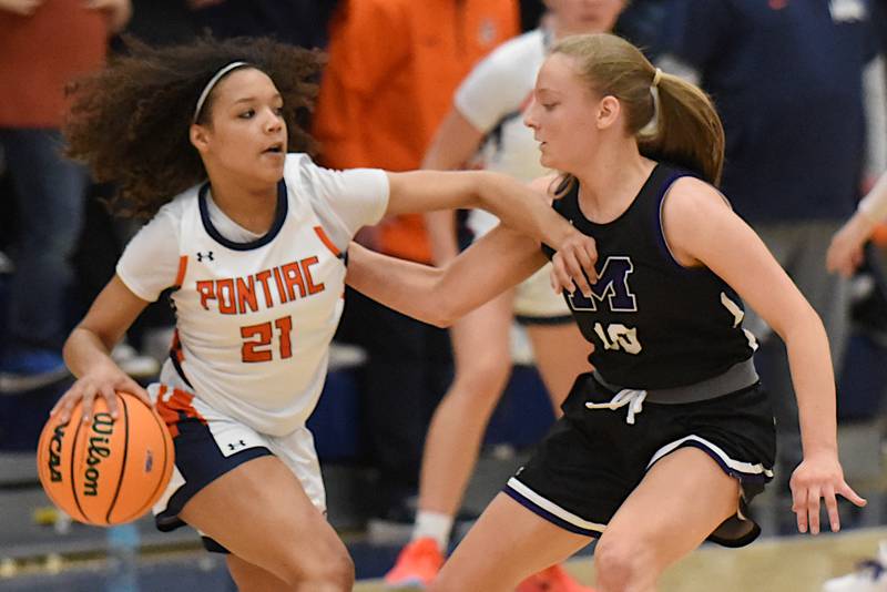 Pontiac's Trinity Miller, left, is defended by Manteno's Alyssa Singleton during the IHSA Class 3A Pontiac Sectional championship Thursday, Feb. 26, 2026.