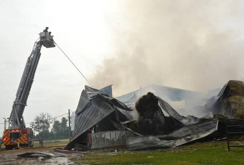 Firefighters from several departments were called to the scene of a shed fire at the intersection of Illinois Route 2 and Lost Nation Road, north of Dixon on Friday morning. Farm machinery and 120-150 round bales of hay were destroyed in the fire which was reported at 6:39 a.m.