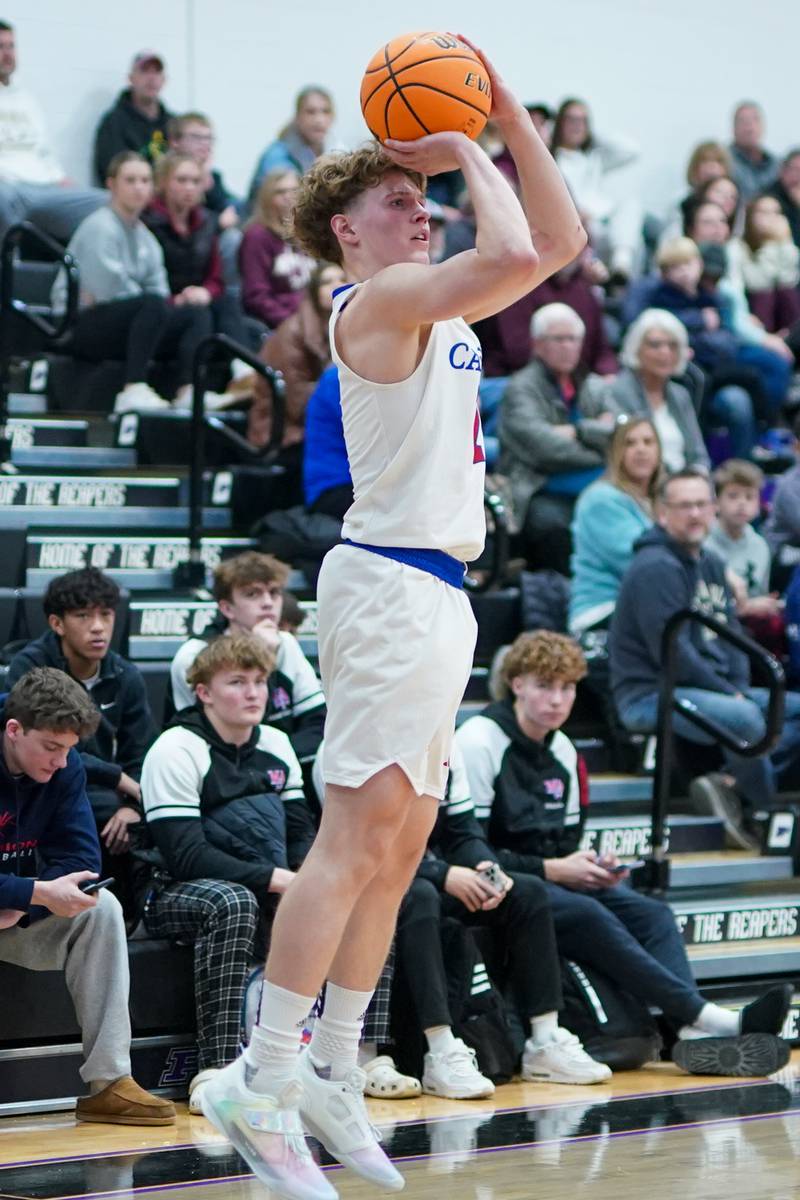 Marmion's Caden Anderson (2) shoots a three pointer during a basketball game in the opening round of the 61st annual Plano Christmas Classic against Morris at Plano High School on Monday, December 23, 2024.