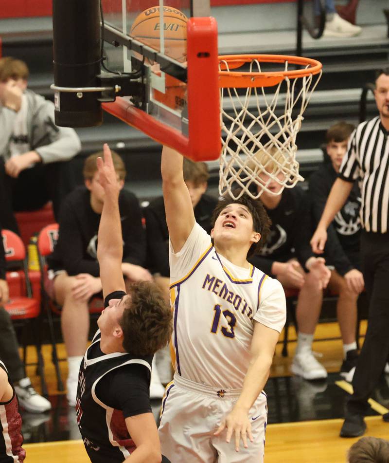 Mendota's Oliver Munoz scores on a a drive to the hoop during the Colmone Classic on Friday, Dec. 12, 2025 at Hall High School.