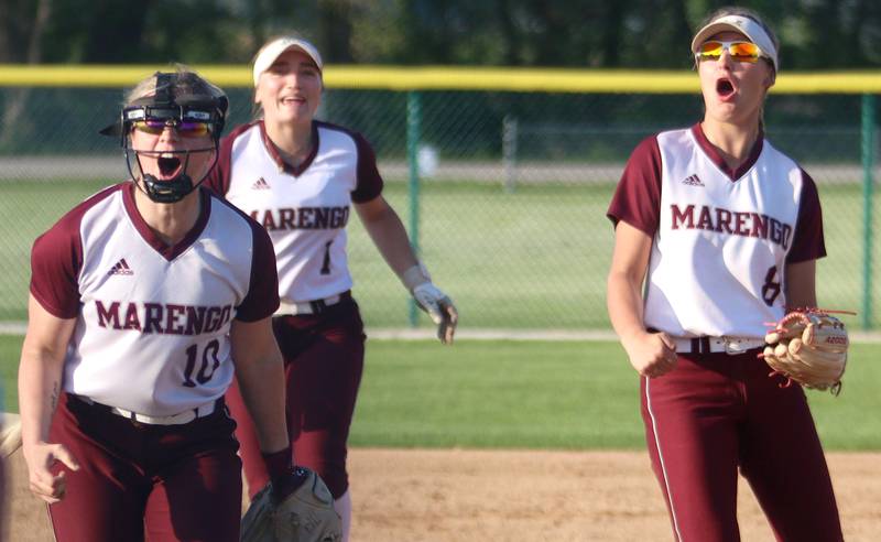 Marengo players, from left, Lilly Kunzer, Gabby Christopher and Gabby Gieseke react after the final out in a win over Richmond-Burton in varsity softball at Marengo Monday.