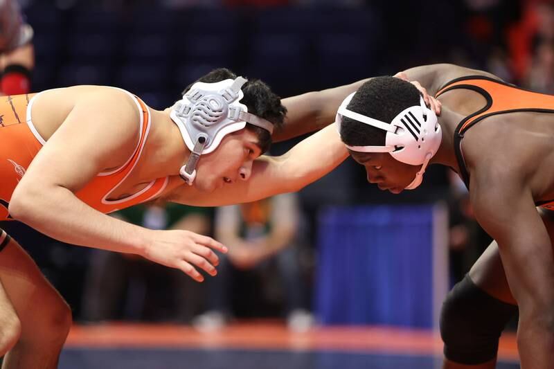 Dekalb’s Damien Lopez works against Shepard’s Damari Reed in the Class 3A 152lb. semifinals at State Farm Center in Champaign. Friday, Feb. 18, 2022, in Champaign.