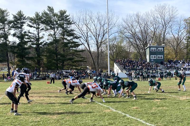 West Carroll quarterback Winter Harrington barks out the cadence as he surveys the Flanagan-Cornell/Woodland defense (at left) Saturday, Nov. 2, 2024, in Savanna.