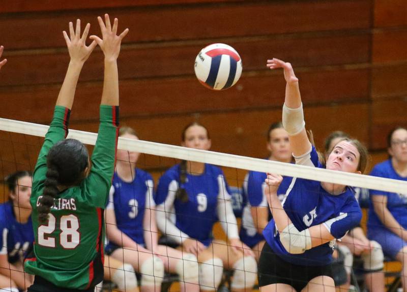 L-P's Karsyn Brucker spikes the ball past L-P's Ava Currie on Tuesday, Aug. 27, 2024 at Princeton High School.