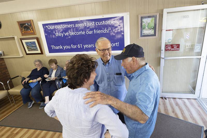 Dick Dir greets friends, family and well-wishers Monday, March 30, 2026, during an open house at Bill and Dick’s Barbershop in Dixon. After 61 years, Dir is hanging up his scissors.
