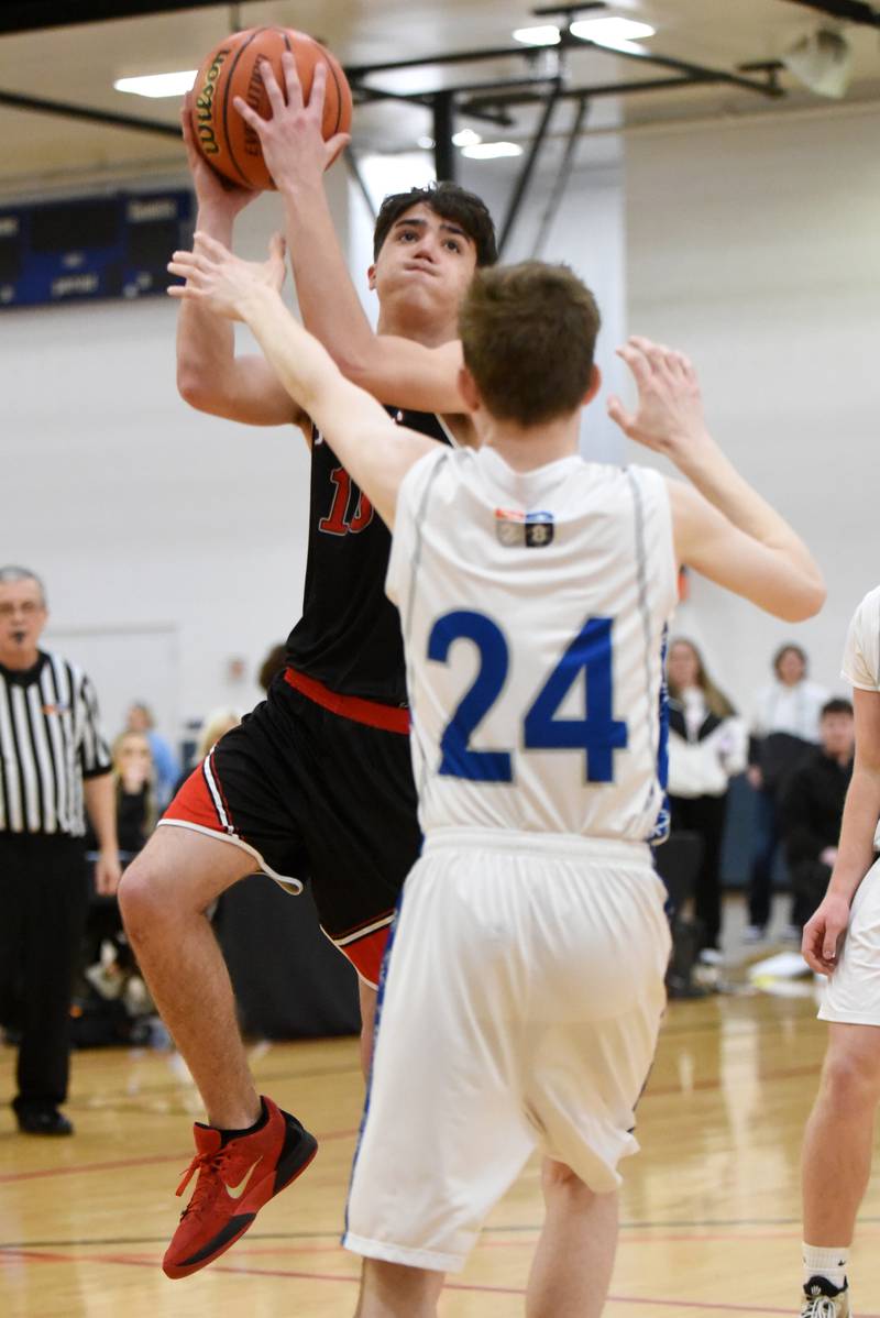 Bradley-Bourbonnais' Josh Danta takes a shot as Mt. Vernon's Ben Pedersen (24) defends during the IHSA Division 1 State championship Special Olympics Unified basketball game Saturday, March 15, 2025, at the University of Illinois Activities and Recreation Center.