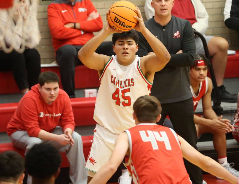 L-P's Andy Medina looks to pass the ball off around Streator's Nolan Lukach during the Dean Riley Shootin' The Rock Thanksgiving Tournament on Monday, Nov. 25, 2024 in Kingman Gym at Ottawa High School.