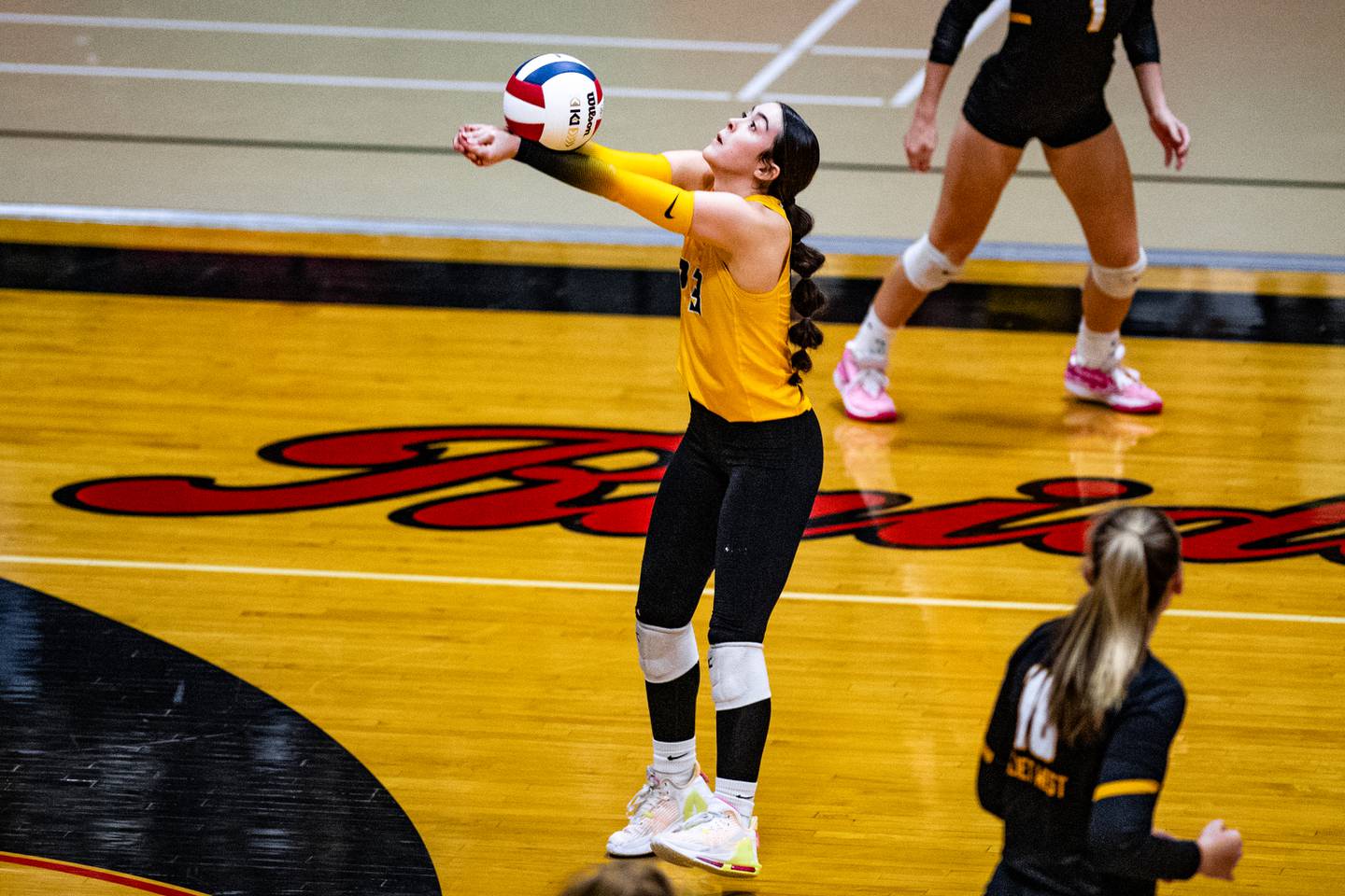 Joliet West's Olivia Baxter bumps the ball back over the net during the super-sectional game against Willowbrook on Friday Nov. 3, 2023 at Bolingbrook High School