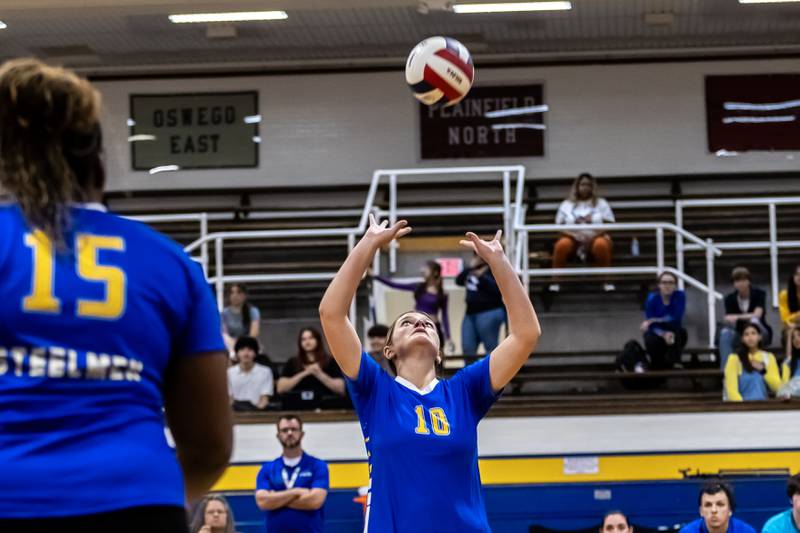 Joliet Central's Lexi Webb sets-up a teammate during a varsity volleyball home game against Lisle on Sept. 22, 2025.
