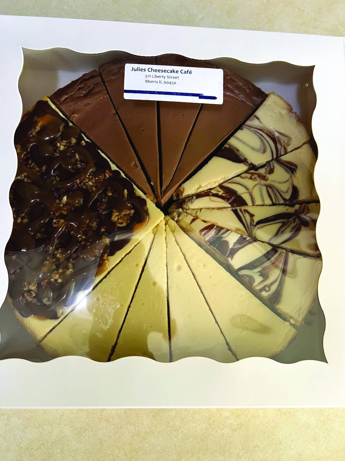 Specialty orders at Julie's Cheesecake Cafe in Morris can include cheescakes featuring multiple flavors, such as this order with chocolate, marbled chocolate, vanilla and turtle flavors.