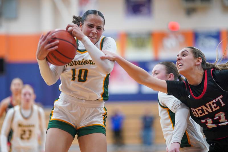 Waubonsie Valley's Danyella Mporokoso (10) rebounds the ball against Benet’s Magdalena Sularski (33) during a Class 4A Oswego Sectional final basketball game at Oswego High School on Thursday, Feb 22, 2024.