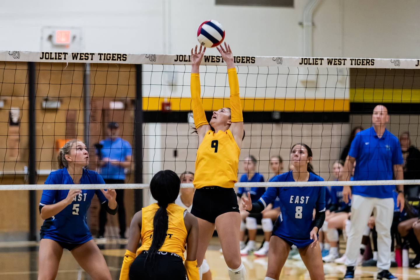 Joliet West's Julia Adams approaches the net against Lincoln-Way East during a Varsity Volleyball match at Joliet West on Aug. 26, 2025.