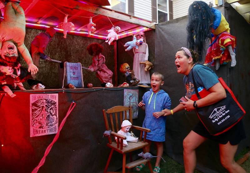 Wyatt and Jenna Caricato get freaked out at the Kamme-O-Circus Halloween Haunted House on Saturday, Oct. 19, 2024 in Elburn.