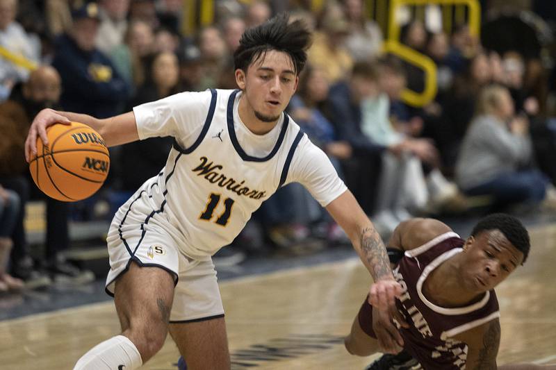 Sterling’s Nico Battaglia works against Moline’s Arthur Abbey Thursday, Jan. 23, 2025.