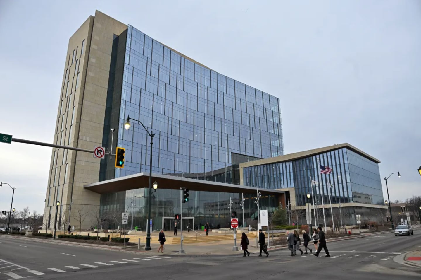 Pedestrians cross the intersection near the Will County Courthouse on Thursday, Jan. 8, 2026, in Joliet, Illinois.