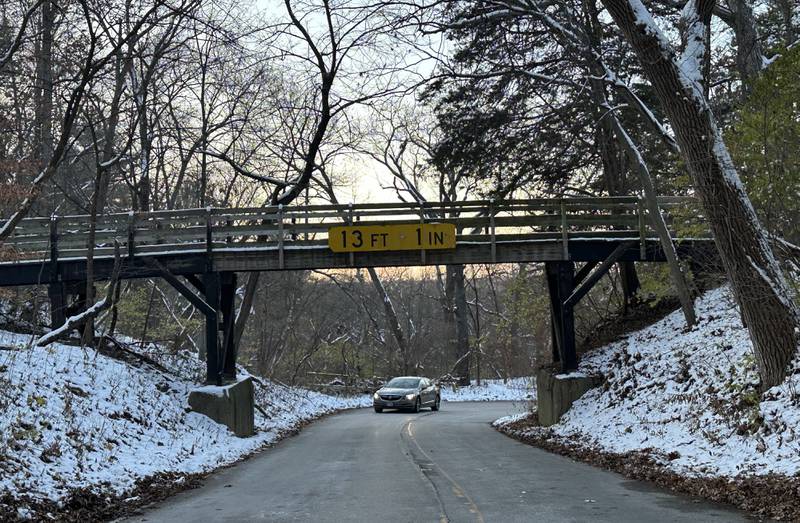 A motorist approaches a pedestrian bridge on Tuesday, Nov. 28, 2023 near Starved Rock Lodge at Starved Rock State Park. The bridge has a vertical clearance of 13 feet 1 inch.