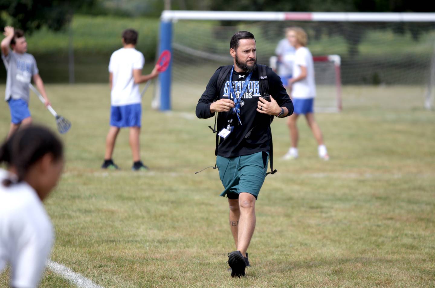 United States Air Force veteran and physical education teacher Garrett Lane works with some of his students at Geneva Middle School South.