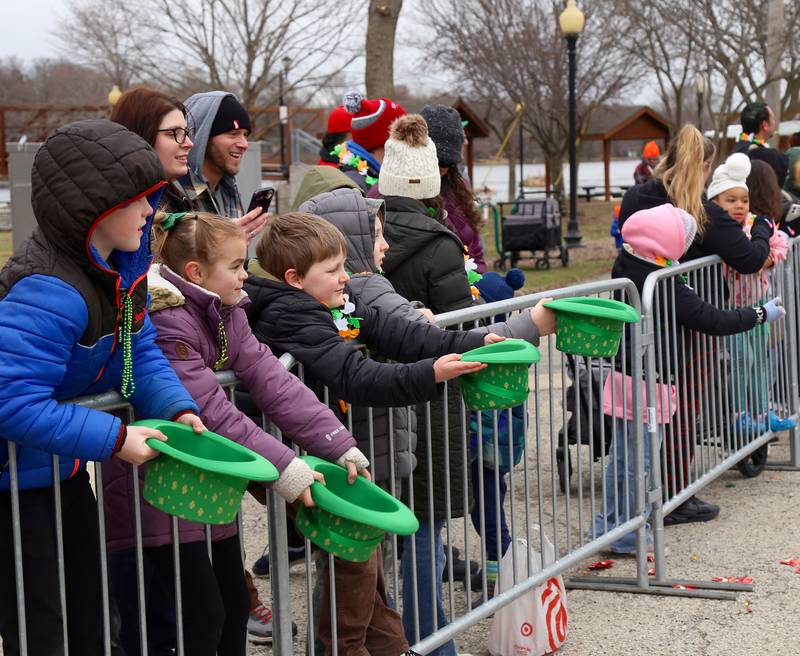 Kids hold out Irish caps to collect candy at the Irish Parade that
was part of the Yorkville Parks and Recreation St. Patrick's Day
Celebration on Saturday, March 14, 2026 in Yorkville.