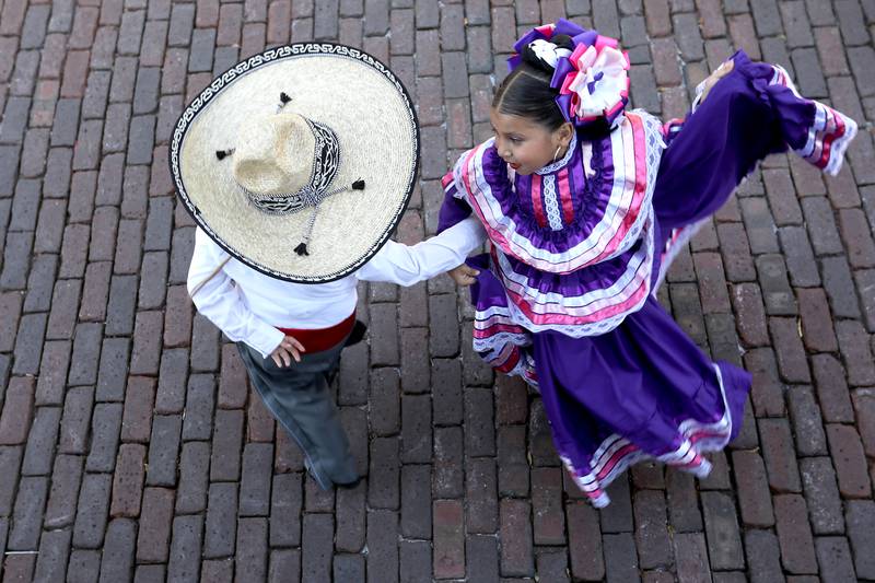 Nicolas Gonzalez and Ella Orbuna from Ballet Folkloric Erandi perform on Sunday, Sept. 14, 2025, during the annual Hispanic Connections Mexican Independence Day Celebration in the Historic Woodstock Square. The celebration featured music, food and culture.