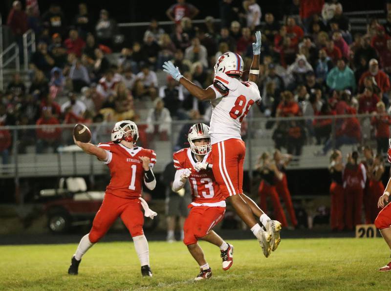 Streator quarterback Isaiah Weibel throws a pass while being pressured by Ottawa's Hector Valdez on Friday, Sept. 6, 2024 at Doug Dieken Stadium in Streator.