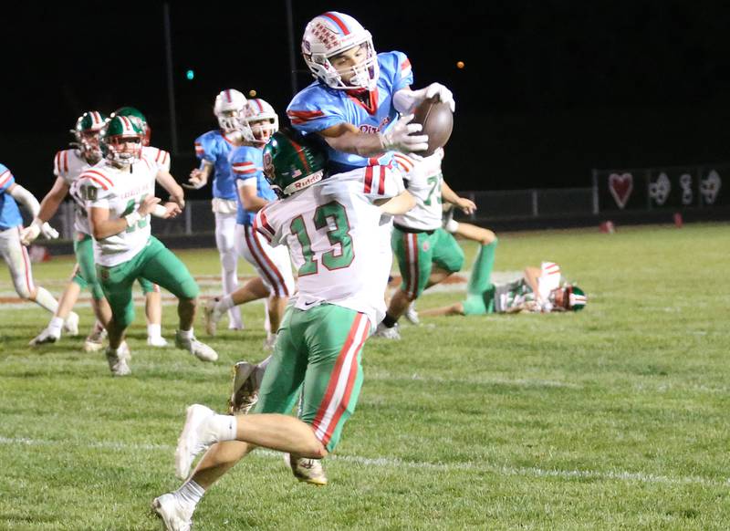 Ottawa's Andrew Vercolio makes a leaping catch over L-P's Gio Legrenzi on Friday, Oct. 4, 2024 at King Field.