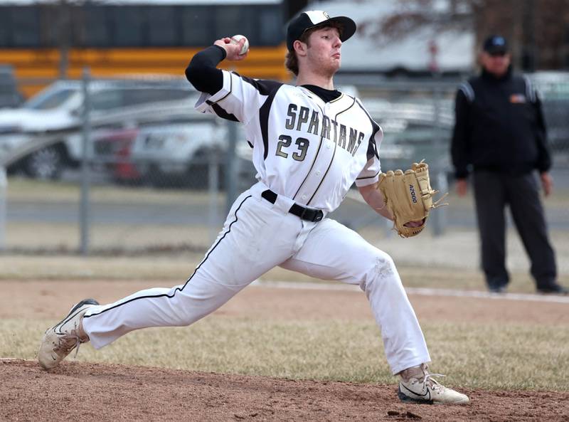 Sycamore's Henry Hamingson delivers a pitch in relief during their game against Byron Wednesday, March 26, 2025, at DeKalb High School. Sycamore’s home field was damaged in last week’s storms so today’s game was played on DeKalb’s field.