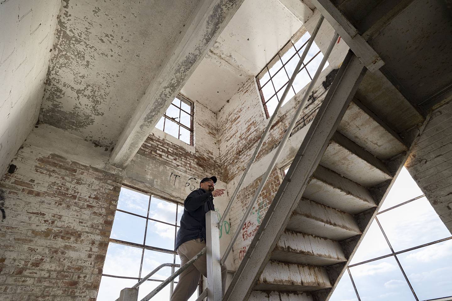 Sterling City Manager Scott Shumard climbs to the top floor of Lawrence Bros. building during a tour in October 2022.