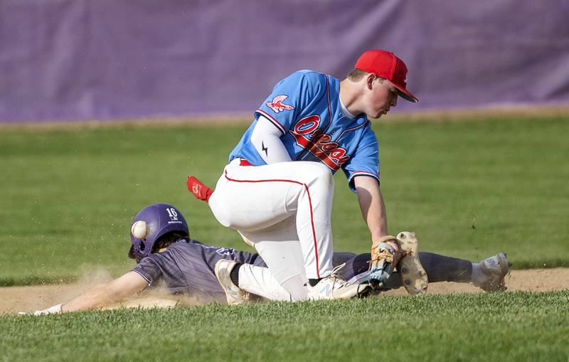 Dixon’s Jake Zepezauer steals second as the balls skips by Oregon’s Jackson Messenger Thursday, April 24, 2025.