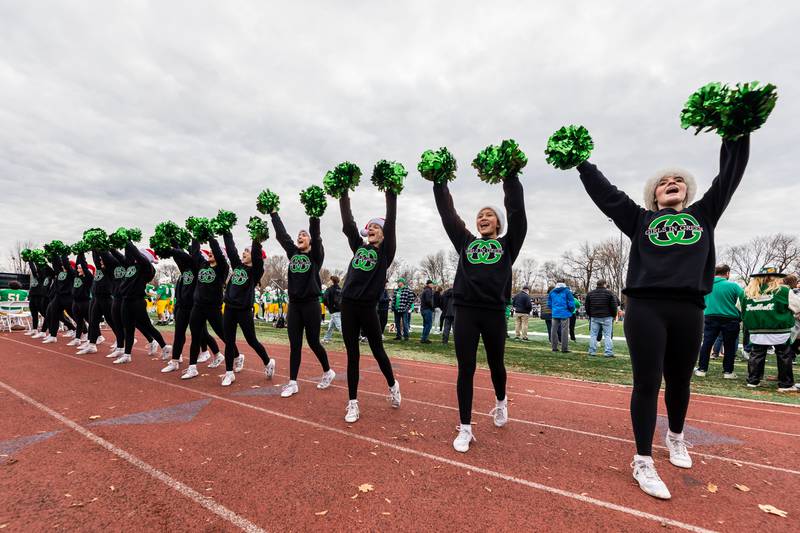 Providence’s cheer team shares school spirit during a 5A varsity football semifinal game against Oak Forest at Providence Catholic High School on Nov. 22, 2025.
