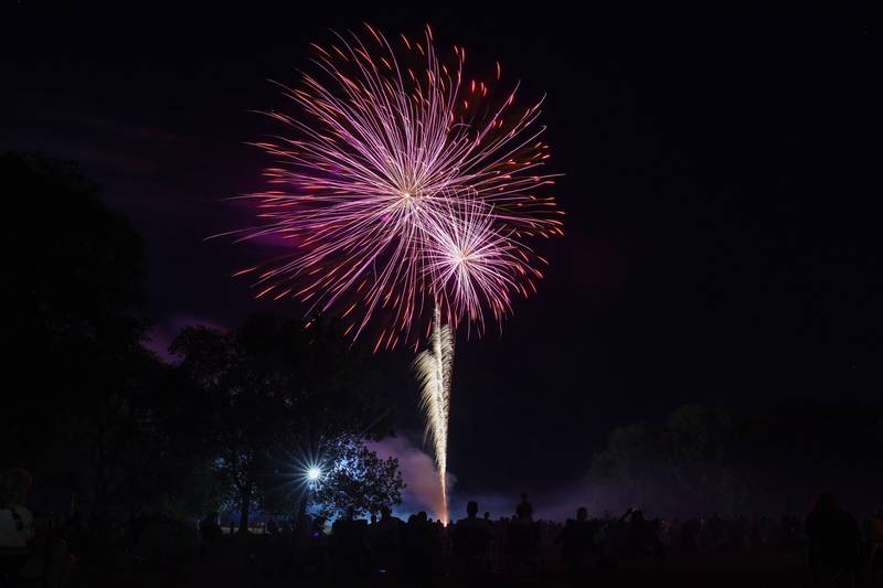 Spectators watch the city of Kankakee's fireworks show at Kankakee Community College on Friday, July 4, 2025.
