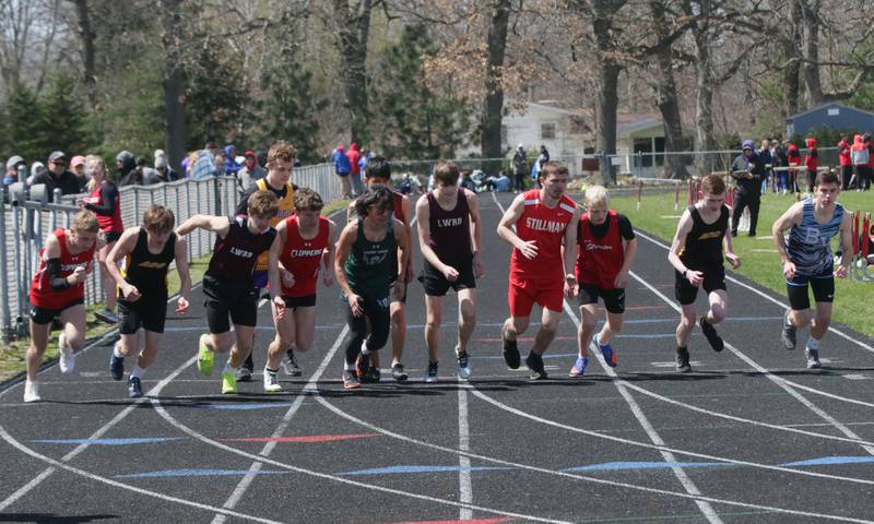 Boys begin the 3200 meter run during the Rollie Morris Invite on Saturday, April 16, 2022 at Hall High School in Spring Valley.