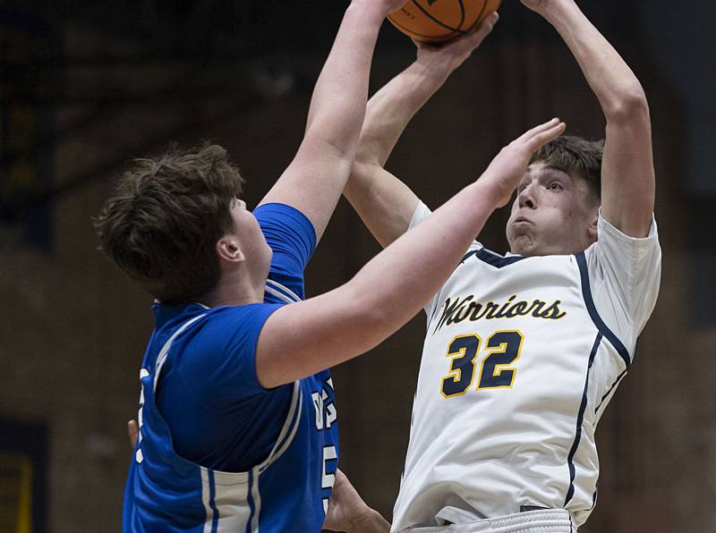 Sterling’s Jack Saathoff puts up a shot against Quincy’s Brennen Lepper Friday, Jan. 30, 2026.