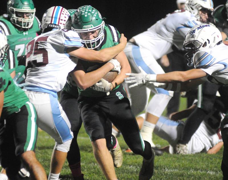 Seneca's Cam Shriey fights off a tackle by St. Joe-Ogden's Logan Umbarger (25) on Friday, Oct. 17, 2025 at Seneca High School.