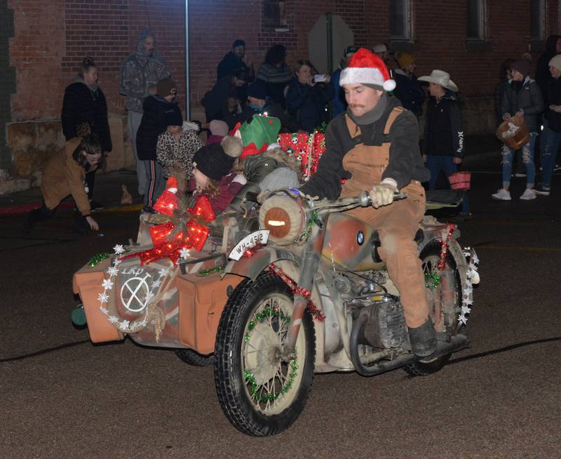 This antique motorcycle and its side car was one of the entries in the Erie Hometown Holidays Lighted Parade on Saturday, Dec. 2, 2023.