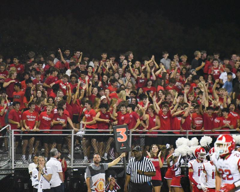 Hinsdale Central students celebrate after the football team scores a touchdown during the game on Friday Sept. 12, 2025, while traveling to take on Downers Grove North High School.