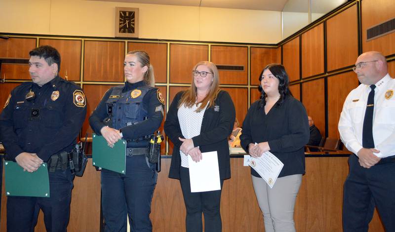 Rock Falls police and Whiteside County 911 dispatchers were honored during the March 19, 2024, Rock Falls City Council meeting for saving the life of a Rockford man. Left to right: Officer Kristofer Perez, Sgt. Betony Gluff, 911 dispatchers Tara Baumgartner and Alexis Echebarria and Police Chief David Pilgrim.