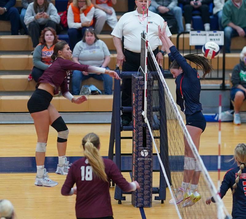 Lockport's Kylee Schurig (6) watches her kill attempt sail past Oswego’s Ava Flanigan (12) during a class 4A Oswego Sectional semifinal match at Oswego High School on Monday, Oct. 30, 2023.