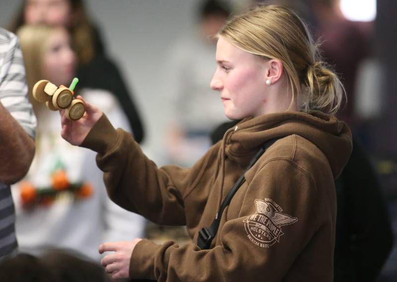 Chloe Moore of La Moille Grade School, carries her edible car to the ramp during the 29th annual Edible Car Contest on Wednesday, Feb. 26, 2025 in the cafeteria at Illinois Valley Community College.