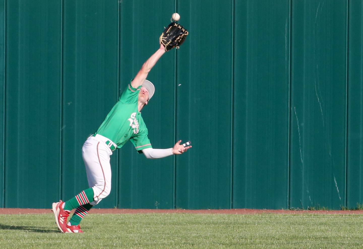 Adrian Arzola makes a catch in the outfield against Morris during the Class 3A Regional semifinal game at Huby Sarver Field in La Salle.