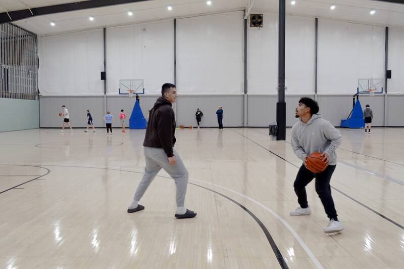 Ricardo Cortes, right, and Eric Davila, both of Sterling, play one-on-one basketball at Westwood Fitness & Sports Center on Tuesday, Nov. 21, 2023. Westwood is one of the Sterling Park District's many parks and facilities.