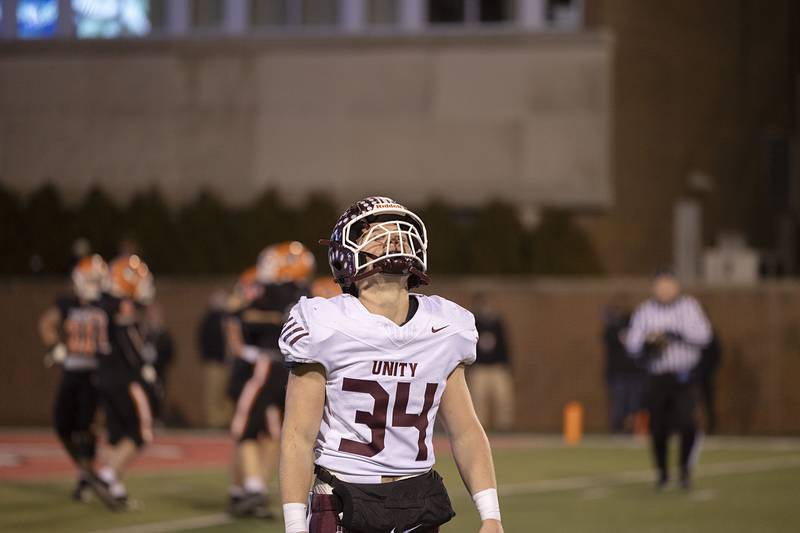 Tolono-Unity's Crewe Eckstein walks off the field as time expires Friday, Nov. 28, 2025, in the Class 3A football finals at Hancock Stadium at ISU.