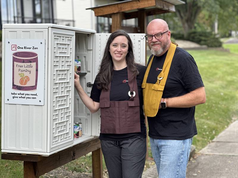 One River Zen founders Vanessa Roddam and Michael Brunner with the micro pantry display the micro pantry installed at 121 E. Prospect Ave. in Ottawa.