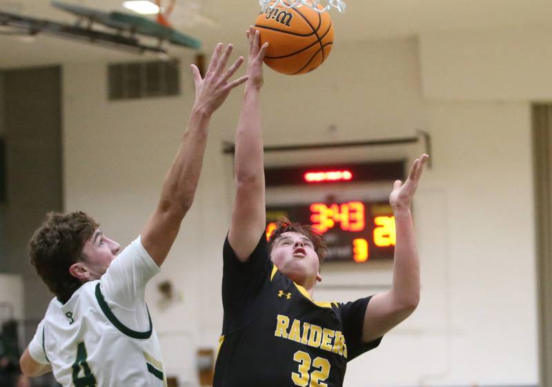 Ashton-Franklin Center's Nolan Rueff runs in for a layup past St. Bede's Gino Ferrari during the Class 1A Regional quarterfinal game on Monday, Feb. 24, 2025 at St. Bede Academy.