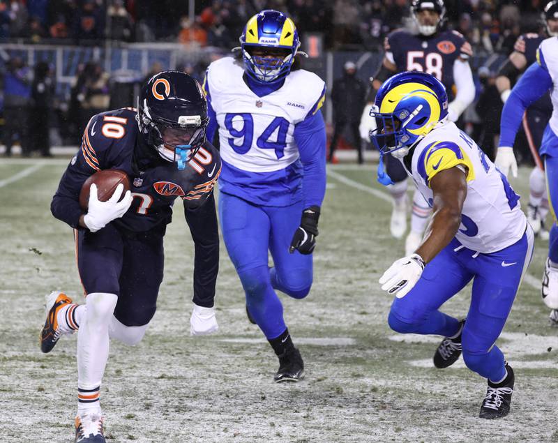 Chicago Bears wide receiver Luther Burden IIItries to get by Los Angeles Rams safety Kamren Kinchens Sunday, Jan. 18, 2026, during their NFC divisional playoff matchup at Soldier Field in Chicago.
