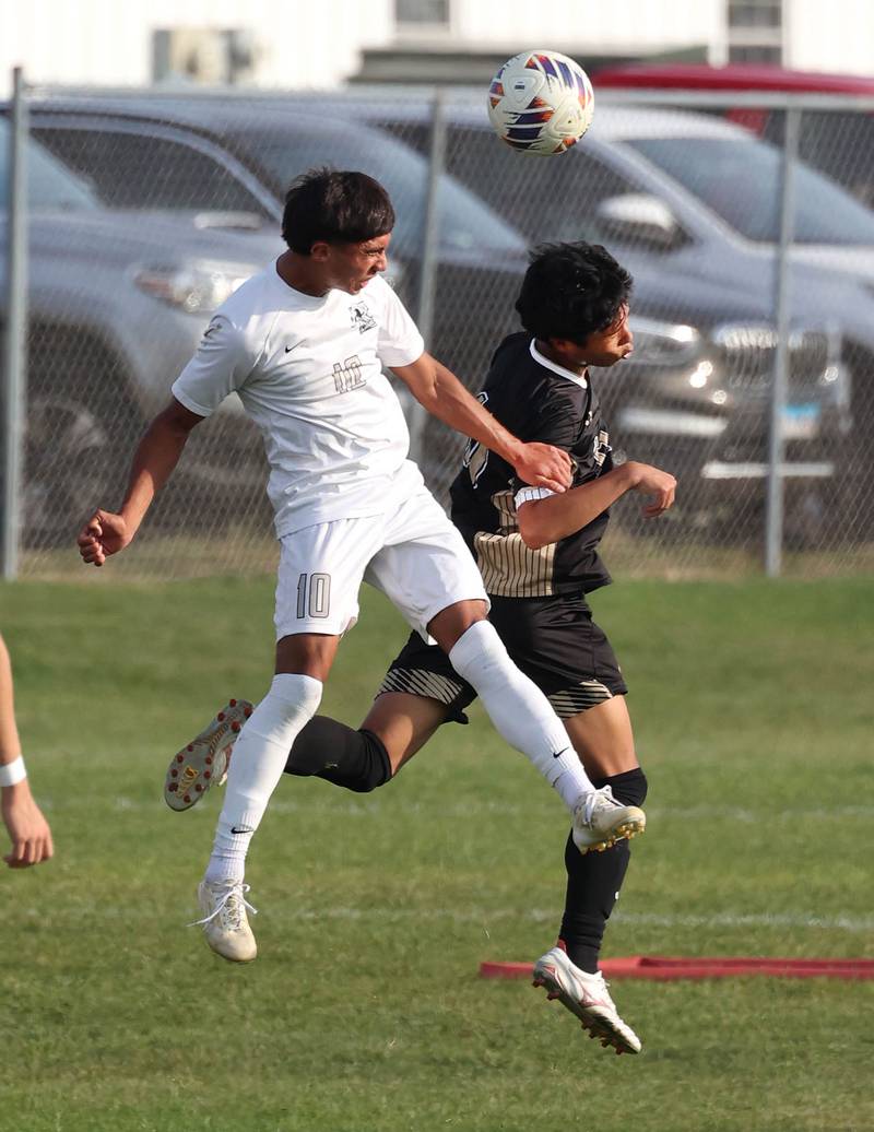 Kaneland's Jovani Ruiz (left) and Sycamore's Chandler Gatbunton go up for a header during their game Wednesday, Sept. 18, 2024, at Sycamore High School.