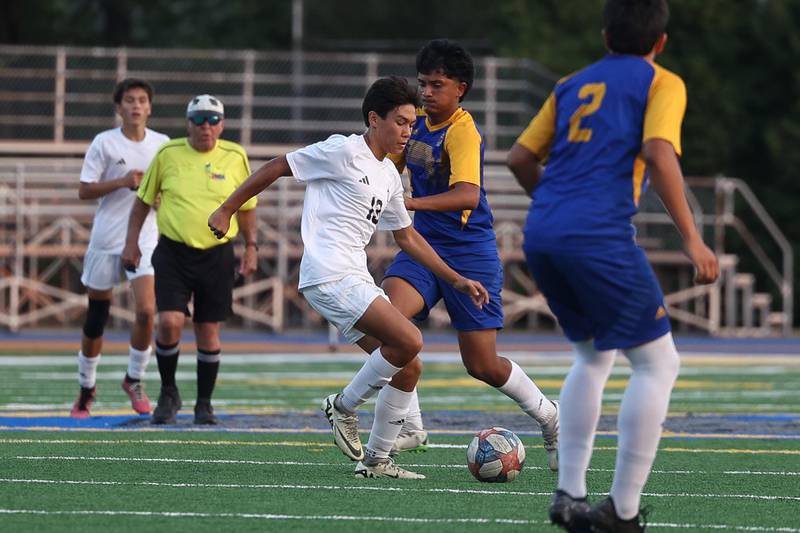 Joliet Catholic’s Lukas Klein works the ball midfield against Joliet Central on Monday, Sept. 9, 2024 in Joliet.