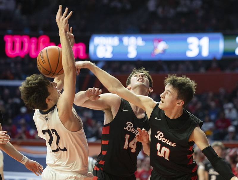 New Trier’s Logan Feller is fouled by Benet Academy’s Andy Nash against Friday March 10, 2023 during the 4A IHSA Boys Basketball semifinals.
