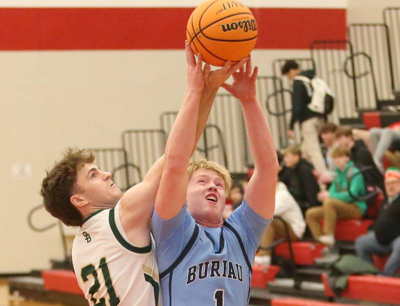 St. Bede's Gus Burr and Bureau Valley's Bryce Helms reach up to grab a rebound during the 50th annual Colmone Classic on Thursday, Dec. 12, 2024 at Hall High School.