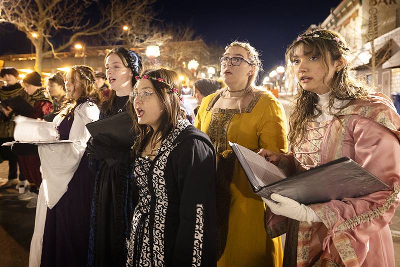 The Dixon High School madrigal singers entertain the crowd Friday, Dec. 6, 2024, in downtown Dixon for the annual Christmas Walk.