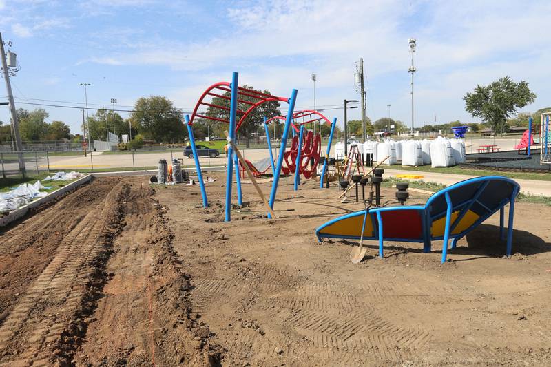 Crews from Build LLC Custom Playgrounds construct a ninja obstacle course located south of the splash pad on Thursday, Oct. 2, 2025 in Washington Park in Peru. The city will also be installing ice rink chillers soon for the upcoming winter season.